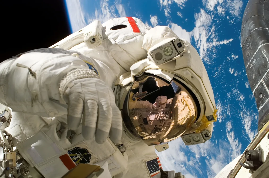 Astronaut floating on a spacewalk above Earth