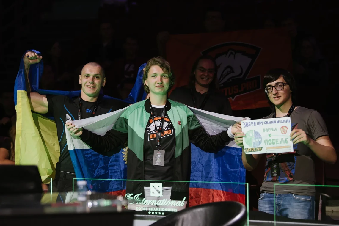 Virtus.pro players waving flags at The International