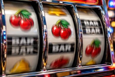 Slot reels stop button